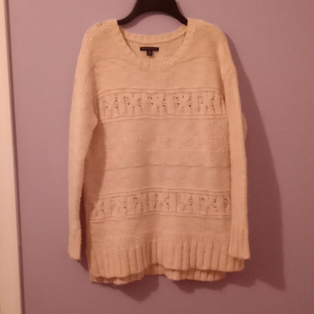 Cream-colored sweater.